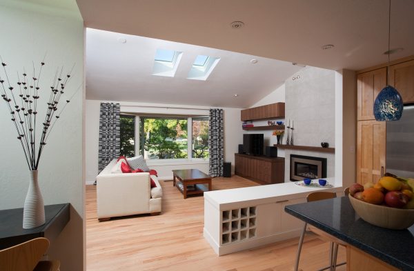 A living room with natural light provided by overhead skylights
