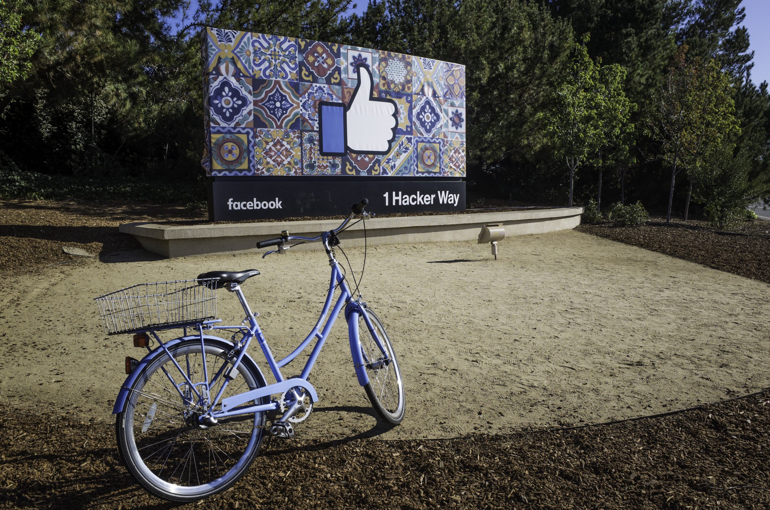 Menlo Park Facebook Sign with a blue bike in front of it.